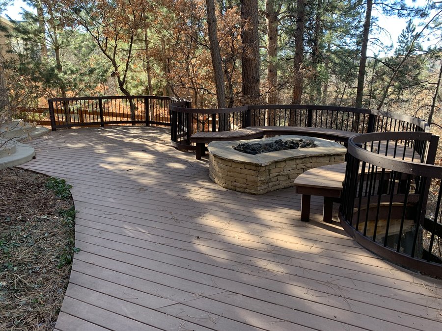 Outdoor kitchen and firepit backyard entertaining space in Denver